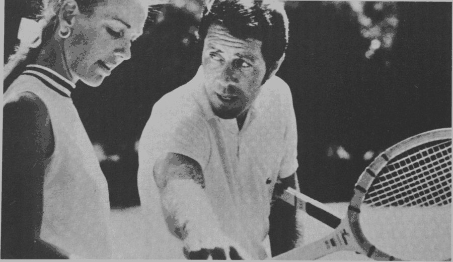 A guest listens intently as professional Nick Bollettieri gives her pointers at the Cerromar Beach Hotel in Puerto Rico.